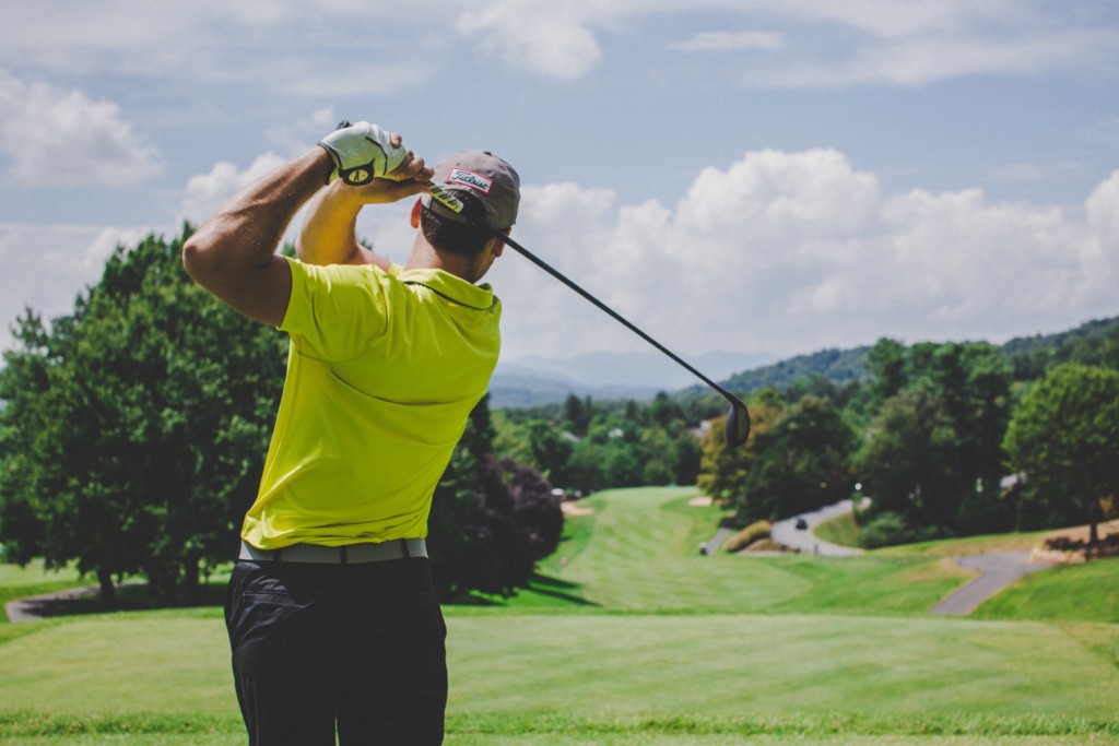 A golfer completes his swing in comfort. Carpal Comfort - Designed to Soothe Carpal Tunnel Pain